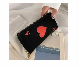 Detail view of Ace of Hearts canvas clutch purse with golden zipper for women