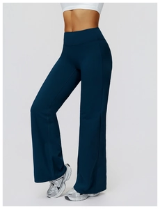 Detail view of high-waist flared yoga pants in navy blue with tummy control waistband