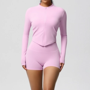 Detail of lavender yoga set featuring a zip-up jacket with thumbholes and V-shaped hemline
