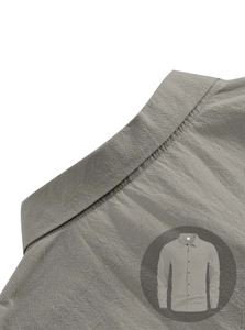 Close-up of gray long-sleeve linen shirt featuring chest pocket and textured fabric detail