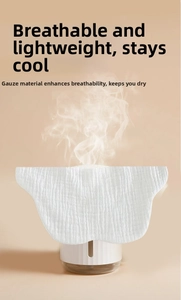 Macro shot showing high breathability of white cotton gauze bib with steam passing through