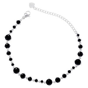 Macro view of silver chain bracelet featuring black cubic zirconia in a prong setting