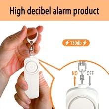 Detail showing hand pulling metal pin on white 130dB high decibel alarm with keychain