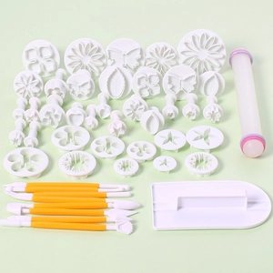 Macro detail of 33-piece fondant modeling tool set with cutters and rolling pin