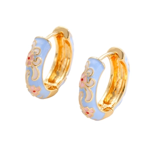 Detail of light blue enamel gold hoop earrings with delicate pink flower patterns