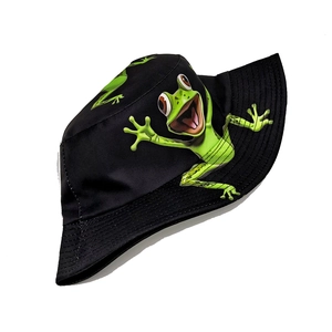 Top-down view of black bucket hat featuring a vibrant green cartoon frog print on the front