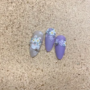 Embossed floral nail stickers featuring cute white rabbits and elegant flower patterns