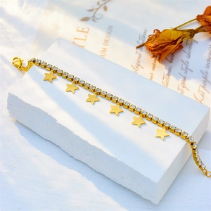 Elegant gold titanium steel star bracelet featuring white zircon pavé and lobster clasp