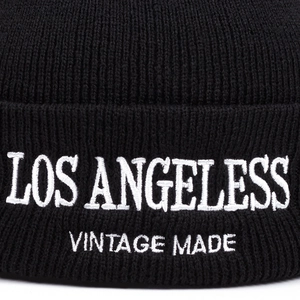 Black knit beanie with Los Angeles embroidery and ribbed texture for winter warmth