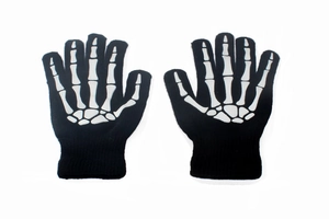 Detail of black knitted gloves featuring a white skeleton bone pattern for Halloween