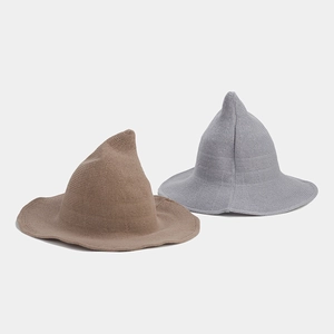 Close-up of brown and grey knitted wizard hats showing detailed crochet texture