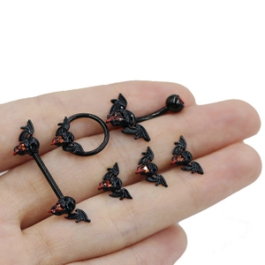 Gothic body jewelry set featuring black bat and skull designs with red rhinestones