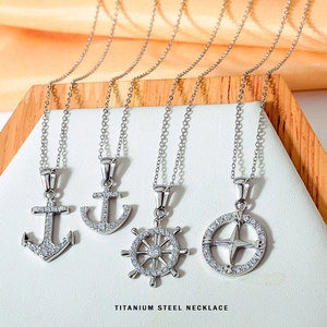 Vintage silver titanium steel nautical necklaces featuring anchor, helm, and compass charms