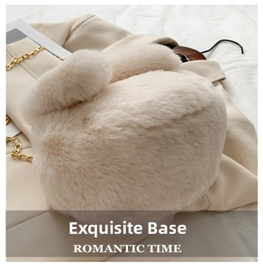 Detail view of the plush rabbit bag base with elegant gold chain strap accents
