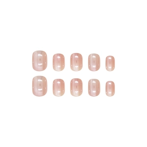Handmade light pink pearl cat eye press-on nails set with 10 oval nails on white background