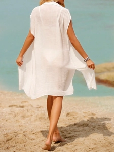 Close-up of white semi-transparent beach cover-up with lightweight fabric texture