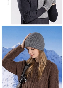 Detail of grey ribbed knit winter set showing texture of hat scarf and gloves for men