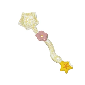 Cute floral ceramic dessert spoon with pink flower and yellow star on wave handle