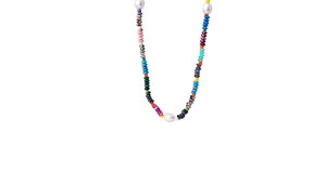 Detailed shot of handmade ethnic necklace featuring colorful natural stones and pearls