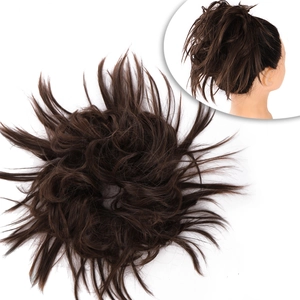 Macro view of messy synthetic hair bun extension in dark brown on a white background