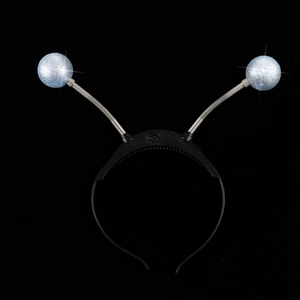 Detail of alien eyeball headband with spring silver sequin balls and LED power switch