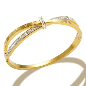 Polished gold stainless steel bangle with crisscross design and Roman numeral crystals