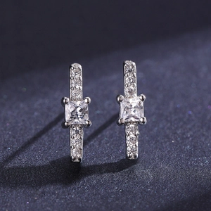 S925 sterling silver square zircon stud earrings with sparkling accents on blue background