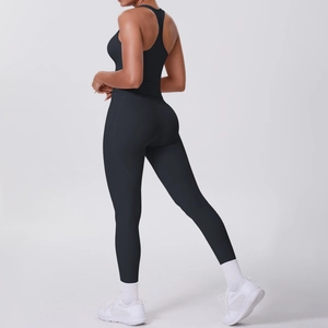 Side view of black ribbed sports bra and high-waist leggings set for fitness yoga