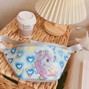 Detail of light blue unicorn waist bag with transparent PVC heart pocket and colorful beads