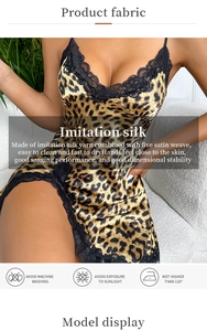 Detail of leopard print satin nightdress with black lace trim and smooth fabric texture