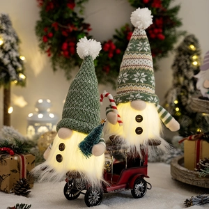 Lighted Christmas gnomes with knitting hats on red vintage truck festive decoration