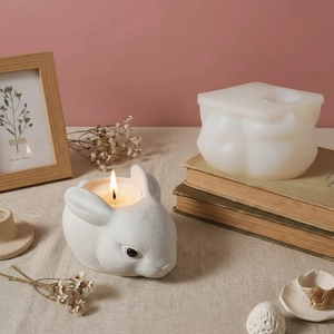 Detailed rabbit shaped silicone mold and finished texture resin candle holder on table
