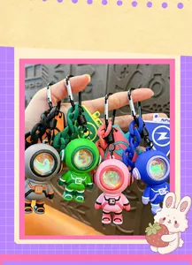Close-up detail of creative astronaut keychains with glowing atmosphere lights in various colors.