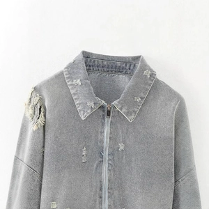 Distressed grey denim motorcycle jacket with ripped details and zipper closure