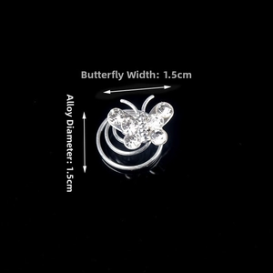 Macro detail of butterfly rhinestone hair coil with 1.5cm width and silver alloy base