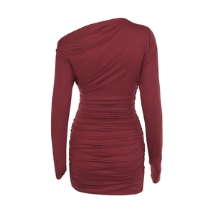 Close-up of ruched texture and elastic fabric on a wine red one-shoulder dress
