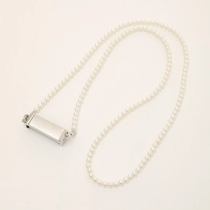 Elegant white pearl phone lanyard with silver rectangular metal clips on beige background