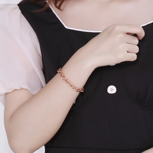 Elegant rose gold stainless steel figure-eight link chain bracelet worn on a wrist