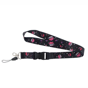 Detailed view of cosmic star pattern polyester lanyard with black buckle and metal hook