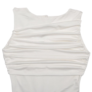 Macro detail of white sleeveless dress showing elegant pleats and ruched chest design