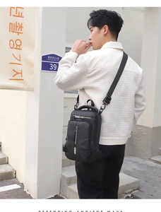 Outdoor street style view showing the back fit of a black waterproof crossbody chest bag