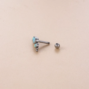 Polished stainless steel labret stud with light blue opals and small metal beads