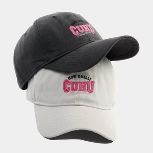 Detail of baseball caps showing premium cotton texture and 3D chenille embroidery