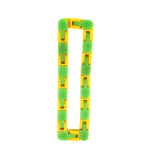 Detail view of yellow and green plastic wacky tracks toy arranged in a rectangle