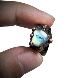 Vintage handmade bronze ring featuring a heart-shaped moonstone with labradorite blue flash