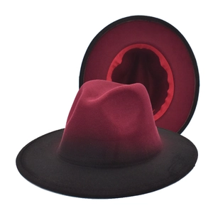 Detail of burgundy and black gradient wool fedora hat with a classic jazz brim design