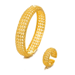 Luxury gold plated hollow leaf bangle and adjustable ring set for women on white background