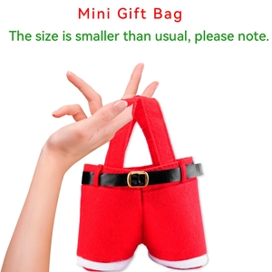 Close-up of a mini Christmas gift bag shaped like Santa pants with black belt and golden buckle