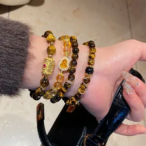 Tiger eye and citrine stone bracelet with golden gourd charm and filigree bead details