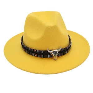 Detail of yellow wool fedora featuring ethnic woven band and silver bull head ornament